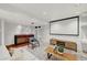 Entertaining basement space with a wet bar, comfortable seating, and a large screen at 1793 E 164Th Pl, Thornton, CO 80602