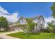 Beautiful two-story home with a manicured lawn, stone accents, and a two-car garage at 1793 E 164Th Pl, Thornton, CO 80602