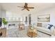 Spacious living room with modern decor, a comfortable sofa, and plenty of natural light at 1793 E 164Th Pl, Thornton, CO 80602