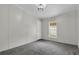 Neutral bedroom featuring gray walls, carpeted floor, white trim and natural light from window at 5688 Alcott St, Denver, CO 80221
