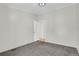 Empty bedroom features gray walls, carpeted floor, and white trim with open door at 5688 Alcott St, Denver, CO 80221