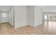 View of hallway leading to the front door, with ceramic tile flooring throughout at 5688 Alcott St, Denver, CO 80221