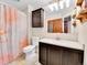 Bathroom featuring a shower with patterned curtain, vanity with storage, and a mirror at 2074 Oakcrest Cir, Castle Rock, CO 80104
