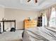 Spacious bedroom features a ceiling fan, and a large window providing plenty of natural light at 2074 Oakcrest Cir, Castle Rock, CO 80104