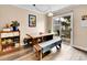 Dining area features rustic table, bench seating, and sliding glass door to deck at 2074 Oakcrest Cir, Castle Rock, CO 80104