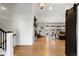 Open-concept living room with light wood floors, shiplap accent wall, fireplace and sliding glass door to the backyard at 4071 S Dahlia St, Cherry Hills Village, CO 80113