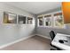 This office features a light gray paint color and a view to the exterior from three windows at 4071 S Dahlia St, Cherry Hills Village, CO 80113