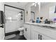 Bathroom featuring glass enclosed shower, modern fixtures, and sleek vanity with marble countertop at 850 Grove St, Denver, CO 80204