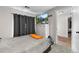 Well-lit bedroom boasts modern design, with TV and outside views at 850 Grove St, Denver, CO 80204