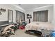 Bedroom featuring wall decor, a window with curtains, carpet, and a comfortable bed at 850 Grove St, Denver, CO 80204