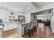 Modern white kitchen with granite countertops, stainless steel appliances, and a view to the living room at 850 Grove St, Denver, CO 80204