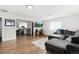 Open-concept living room offers wood floors and a view to the kitchen at 850 Grove St, Denver, CO 80204