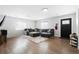 Spacious living room with hardwood floors, lots of natural light, and a comfortable gray sectional couch at 850 Grove St, Denver, CO 80204