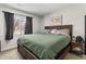 Spacious main bedroom with a large window, comfortable bed, and modern decor at 850 Grove St, Denver, CO 80204