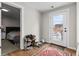 View of a mud room featuring a door leading outside and a view into a bedroom at 850 Grove St, Denver, CO 80204