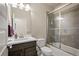 Bathroom with a shower and tub combination, framed glass door, and modern sink at 6780 Canosa St, Denver, CO 80221