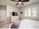 Bright bedroom features a ceiling fan, comfortable bed, and a dresser at 6780 Canosa St, Denver, CO 80221