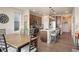 Eat-in kitchen features dark wood cabinets, stainless steel appliances, a quartz countertop, and barstool seating at 6780 Canosa St, Denver, CO 80221