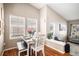 Cozy dining area with lots of natural light, hardwood floors, and modern decor at 1959 Morningview Ln, Castle Rock, CO 80109