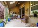 Cozy back porch enhanced with patio furniture, potted plants, and a soothing ambiance for leisure at 3418 New Haven Cir, Castle Rock, CO 80109