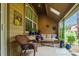 Inviting back porch featuring wicker furniture, potted greenery, and a cozy atmosphere for outdoor enjoyment at 3418 New Haven Cir, Castle Rock, CO 80109