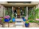 Charming back porch adorned with potted plants and comfortable seating, perfect for relaxation at 3418 New Haven Cir, Castle Rock, CO 80109