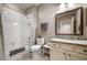 Bright bathroom showcasing a shower-tub combo, decorative mirror, and tiled accents for a clean design at 3418 New Haven Cir, Castle Rock, CO 80109