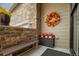 Cozy front porch with a bench, a wreath, and potted flowers, creating a welcoming entrance at 3418 New Haven Cir, Castle Rock, CO 80109