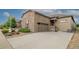Beautiful stone and siding home with a wide driveway leading to an attached two-car garage at 3418 New Haven Cir, Castle Rock, CO 80109