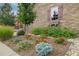 Well-maintained front yard with colorful flowers and healthy plants adding charm to this beautiful home at 3418 New Haven Cir, Castle Rock, CO 80109