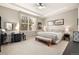 The main bedroom includes a ceiling fan, carpet, a large window, and space for a desk and bench at 3418 New Haven Cir, Castle Rock, CO 80109