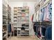 Spacious walk-in closet with custom shelving and ample storage for clothes, shoes, and accessories at 3418 New Haven Cir, Castle Rock, CO 80109