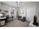 Bright bedroom features carpet, closet, and a sofa for extra seating at 42013 Big Horn Cir, Elizabeth, CO 80107