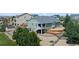 Landscaped backyard featuring multi-level deck, lush lawn, and storage shed, all enclosed by wood fence at 42013 Big Horn Cir, Elizabeth, CO 80107