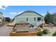 View of backyard featuring deck, stone accents, wood fencing and shade tent at 42013 Big Horn Cir, Elizabeth, CO 80107