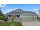 Charming single-Gathering home featuring a well-manicured lawn and a welcoming front porch at 42013 Big Horn Cir, Elizabeth, CO 80107