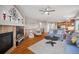 Open-concept living room features fireplace, hardwood floors, and ample natural light at 42013 Big Horn Cir, Elizabeth, CO 80107