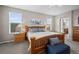 Comfortable main bedroom with natural wood furnishings and soft gray accents at 42013 Big Horn Cir, Elizabeth, CO 80107