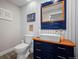 Stylish powder room featuring a unique vanity and modern fixtures at 42013 Big Horn Cir, Elizabeth, CO 80107