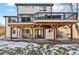 Multi-level deck is supported by wood beams that add character to this outdoor space at 8983 W Capri Ave, Littleton, CO 80123