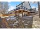 A multi-level deck overlooks the lawn area of the backyard at 8983 W Capri Ave, Littleton, CO 80123