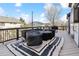 Spacious deck with outdoor furniture, perfect for relaxing and entertaining with a view of neighborhood at 8983 W Capri Ave, Littleton, CO 80123