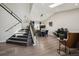 Open-concept dining area with vaulted ceilings and modern black accents at 8983 W Capri Ave, Littleton, CO 80123