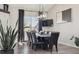 Modern dining room with black accents and natural light, perfect for Gathering dinners at 8983 W Capri Ave, Littleton, CO 80123