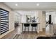 Open concept kitchen with bar seating that connects to other living areas at 8983 W Capri Ave, Littleton, CO 80123