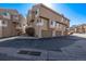 View of modern townhome complex featuring garages and neat landscaping at 4548 E Kentucky Cir, Denver, CO 80246