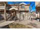 Charming townhome with a quaint entrance, featuring a well-maintained yard and inviting curb appeal at 4548 E Kentucky Cir, Denver, CO 80246