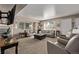Spacious living room with large windows, neutral tones, and a comfortable seating arrangement at 4548 E Kentucky Cir, Denver, CO 80246