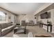 Cozy living room with a sectional sofa, television, and neutral decor, ideal for relaxing or entertaining at 4548 E Kentucky Cir, Denver, CO 80246