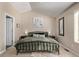Main bedroom featuring art above the bed and side tables, with a picture hanging on the wall at 4548 E Kentucky Cir, Denver, CO 80246